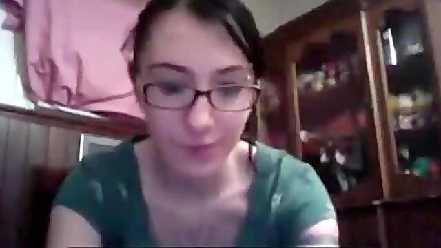 Nerdy girl with glasses masturbates with a toy for her bf on skype