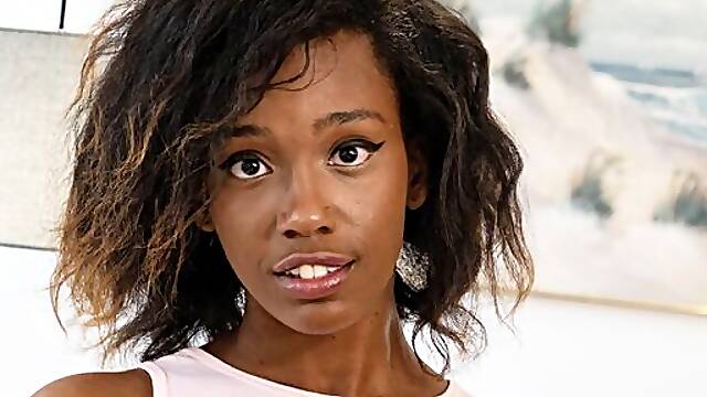Gorgeous ebony doll Lacey London is fucking with a purple sex toy