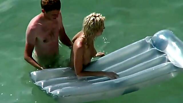 Kama sutra on the beach couples have sex in the sea