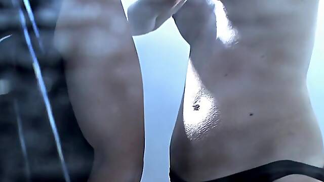 Couple changing in beach cabin