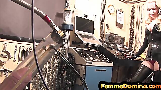 Latex BDSM femdom drains sissy cock with milking machine