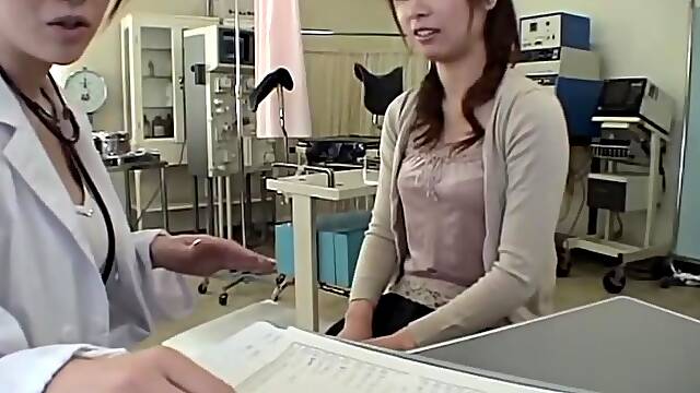 Skinny Jap babe gets banged with a dildo during Gyno exam