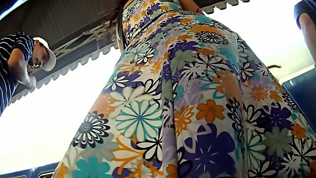 Cutie in a flowery dress makes for hot upskirt magic
