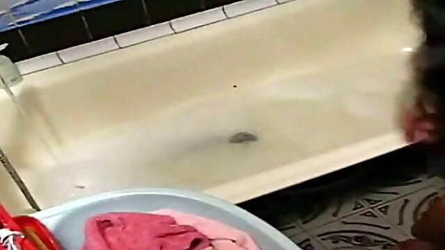 Just a cute Indian young babe in the bath tub on hidden cam