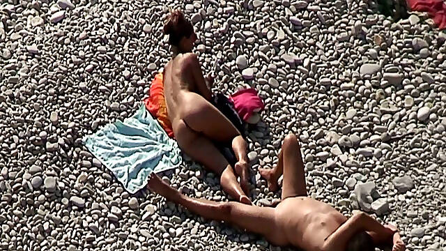 Sweet girlfriend and her man were sunbathing nude on the beach