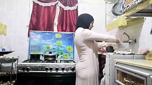 Routine hijab arabic muslim in kitchen