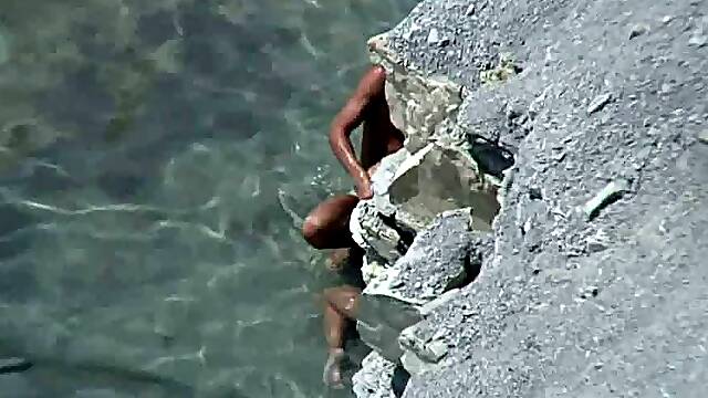Horny couple thinks they can hide behind rocky coast (real voyeur)