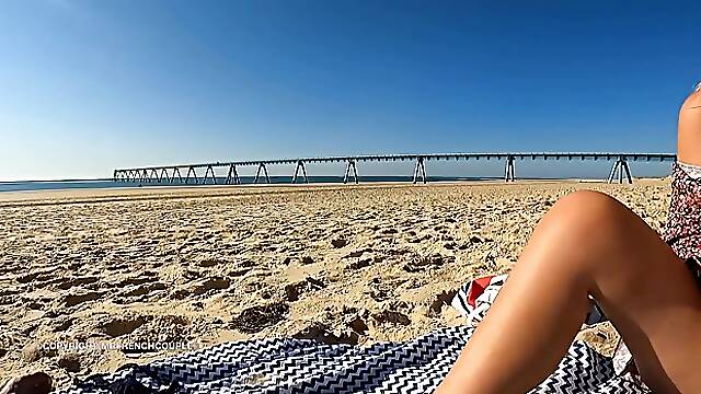 Small tits blonde MILF with sunglasses masturbates with her dildo on the beach