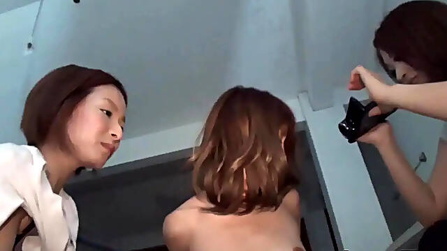 Rough strap-on action in a Japanese lesbo threesome