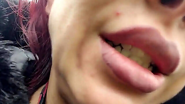 Gorgeous woman with big lips burps on her man in a park