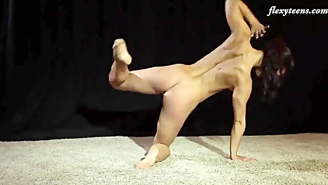 Fit gymnast Eva Rakova bends over in acrobatic porn