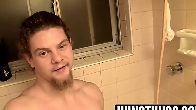 Straight hunk washes and jerks shaved cock in the shower