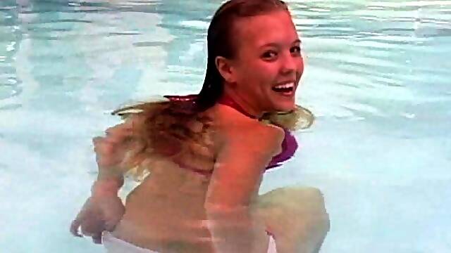 Big boobs bikini girl takes a sexy dip in the pool
