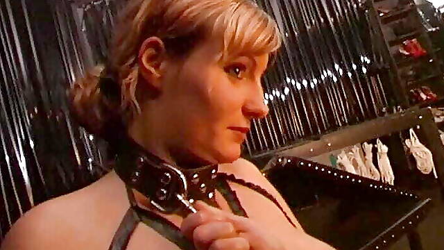 Master brings his slave to the dominatrix 