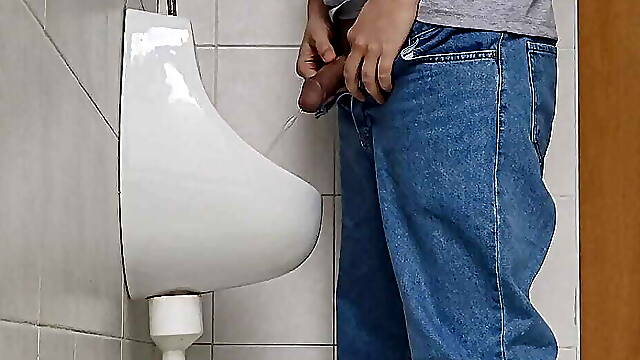 Risky jerk in public urinal at work
