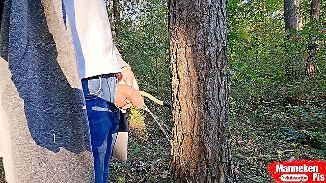 On a walk in the forest, pissing under a tree