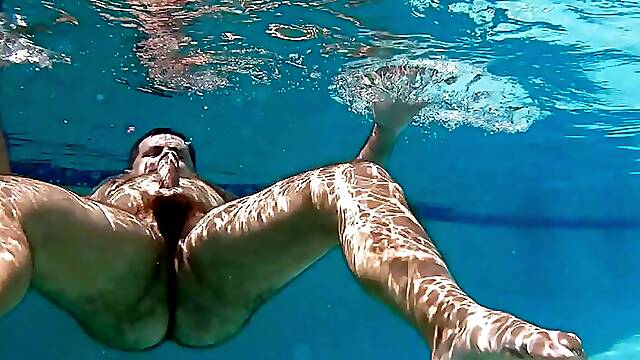 Hairy man frolics and cums underwater!