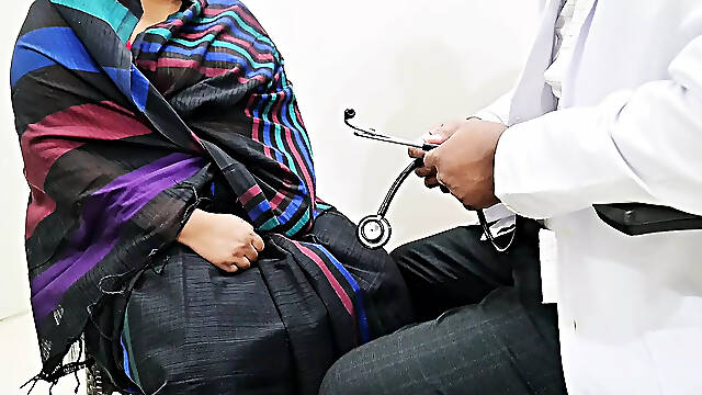 Doctor Rahul checking sridevi in a clinic