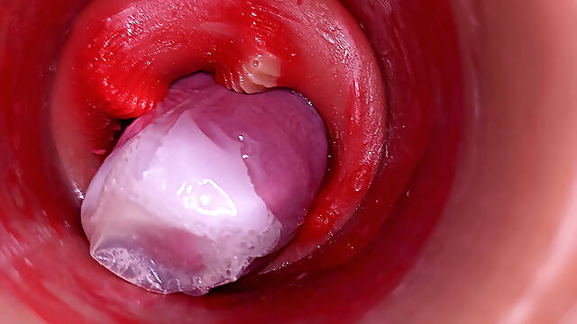 The camera inside the deep pussy records a huge ejaculation with a stuck condom!