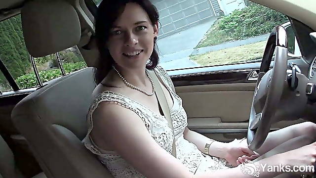 Pretty brunette masturbates in the car during driving