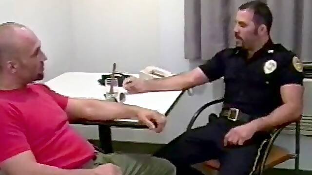 Friendly policeman fucks a horny gay hunk in his workplace